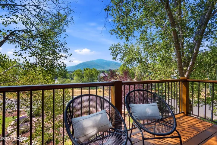 Private balcony with views of the mountains and ski resorts right in the comfort of your primary suite!