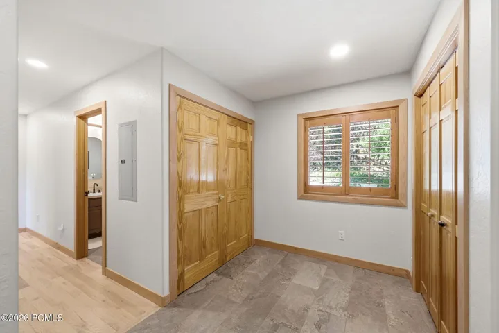 Mudroom with ample storage and heated floors right off of the garage entrance into the home.