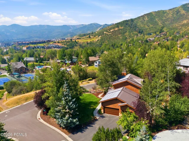 Wood-clad exterior with a metal roof and an attached three-car garage. Views of the Canyons, Deer Valley and Park City Ski Resorts.