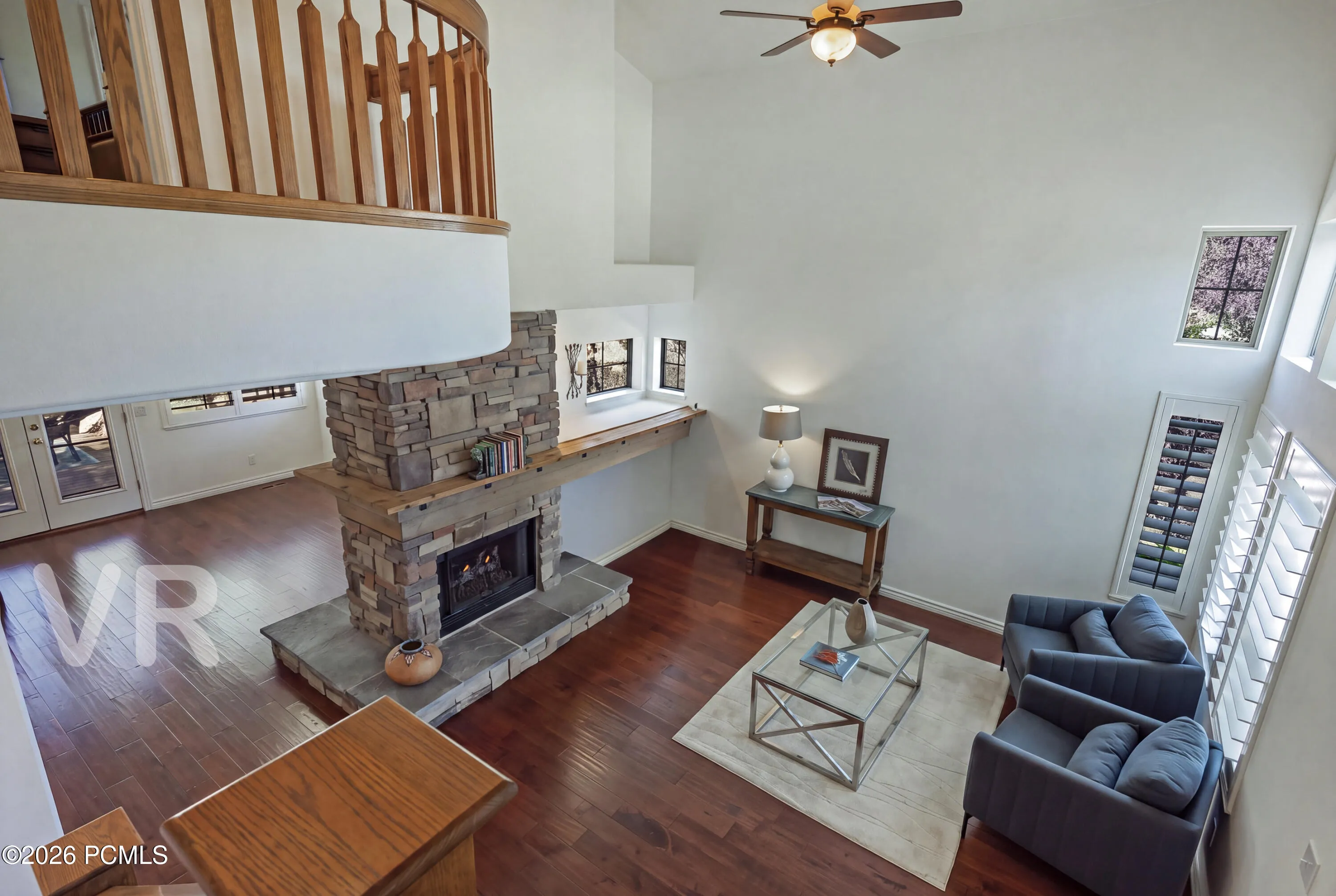 Looking Down on the Living & Family Room with Two-Sided Fireplace