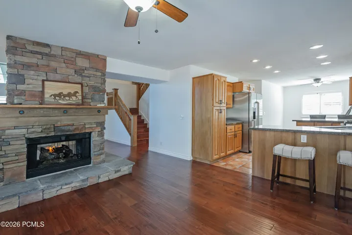 Dining Area & Two-Sided Fireplace to the Kitchen