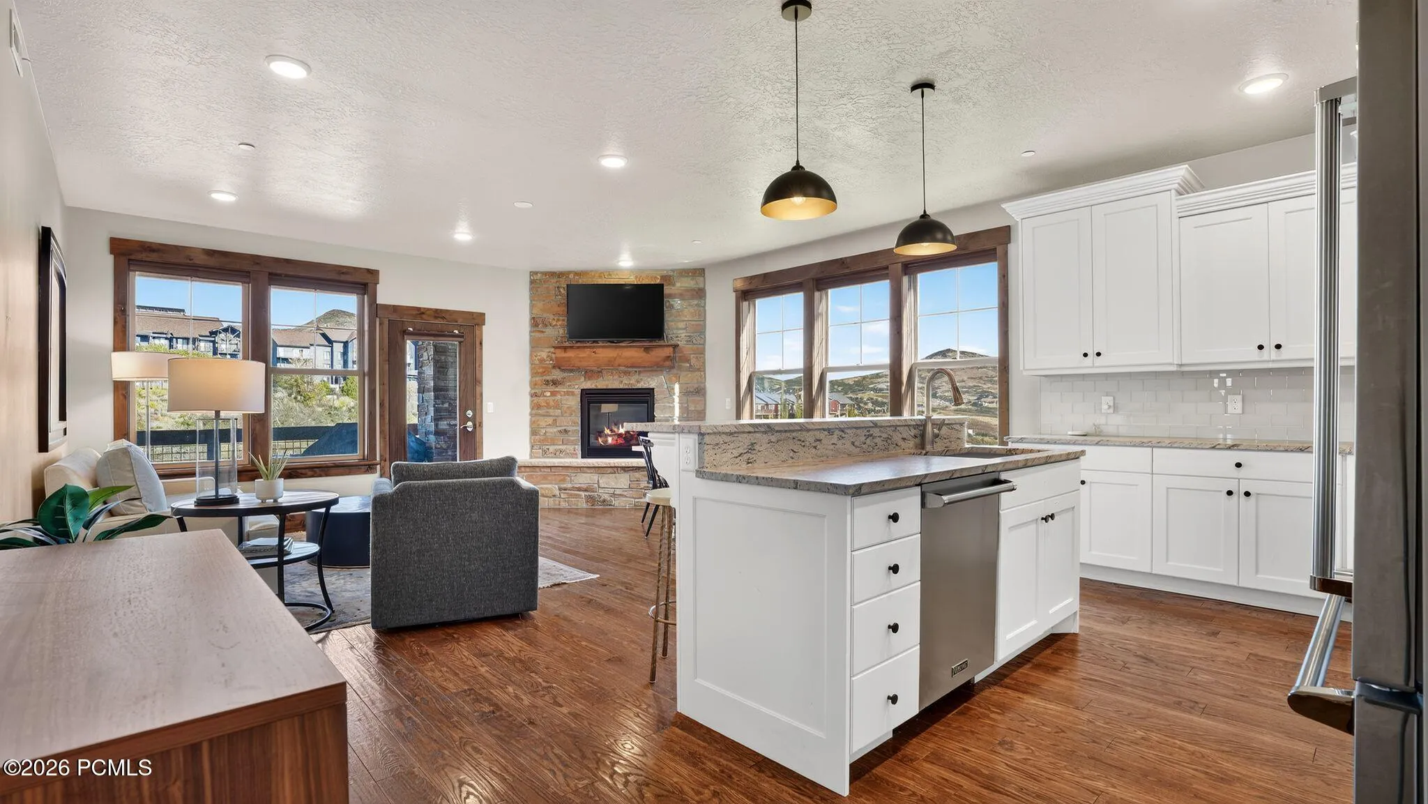 Open concept kitchen and great room with hardwood floors - Deer Park 102, Jordanelle, Heber City UT