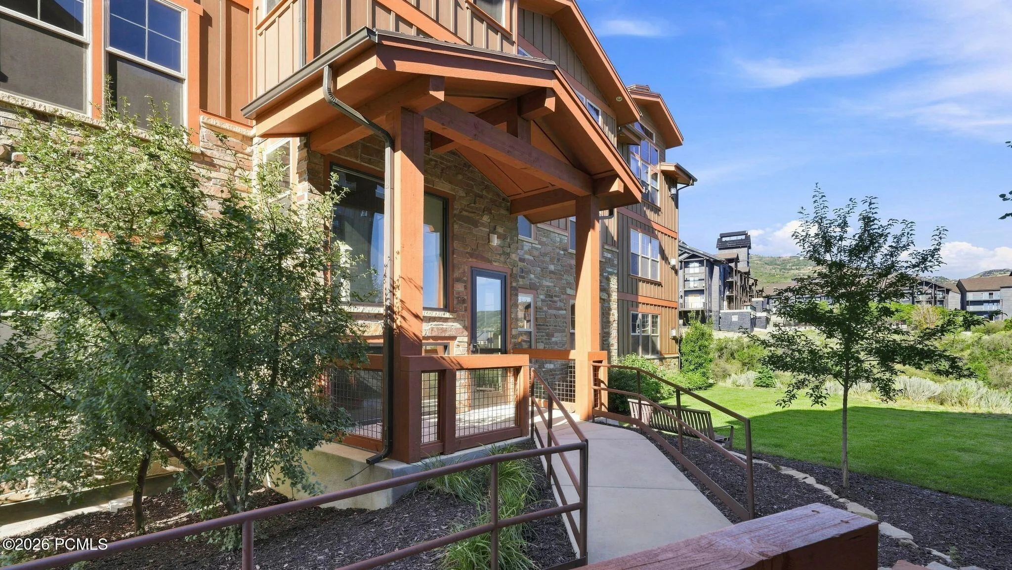 Covered entry with timber and stone detail - Deer Park 102, Jordanelle, Heber City UT