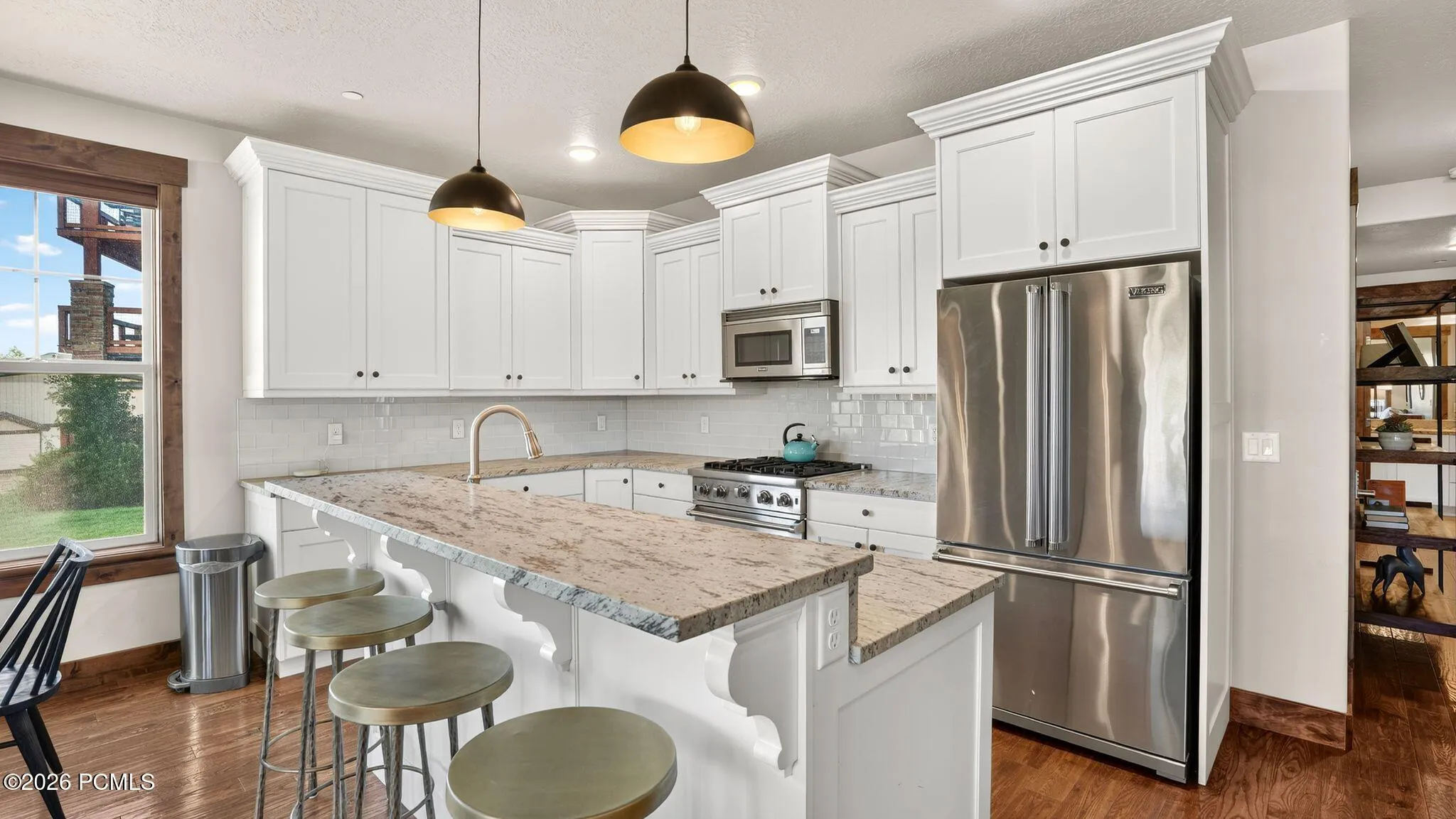 Kitchen island seating with stainless appliances - Deer Park 102, Jordanelle, Heber City UT