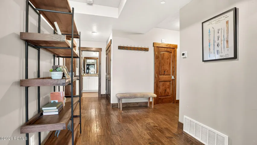 Entry hall with built-in shelving and hardwood floors - Deer Park 102, Jordanelle, Heber City UT