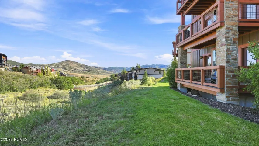 Exterior with lawn and mountain views - Deer Park 102, Jordanelle, Heber City UT