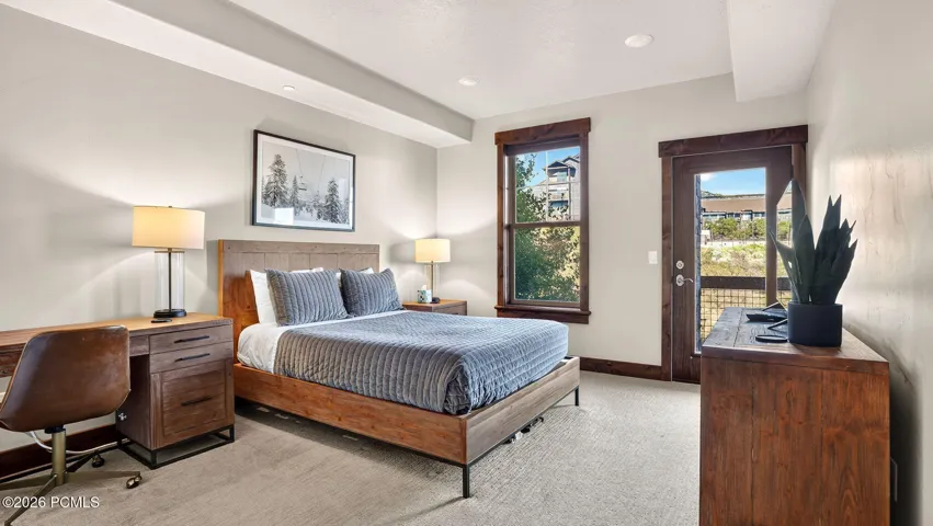 Primary bedroom with private deck access - Deer Park 102, Jordanelle, Heber City UT