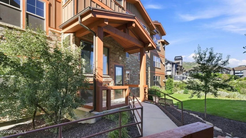 Covered entry with timber and stone detail - Deer Park 102, Jordanelle, Heber City UT