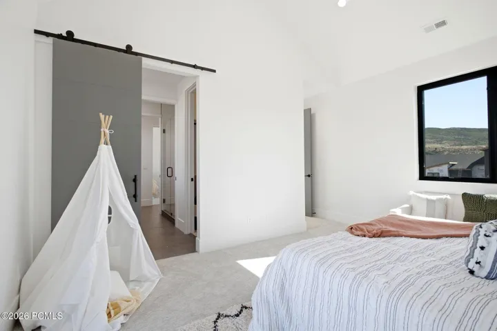 Bedroom 3 of 3 on upper level with outdoor access
