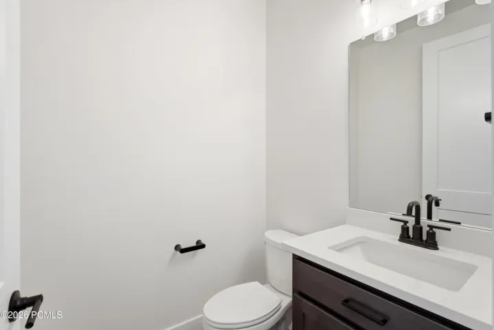 Main level powder room off formal living entry