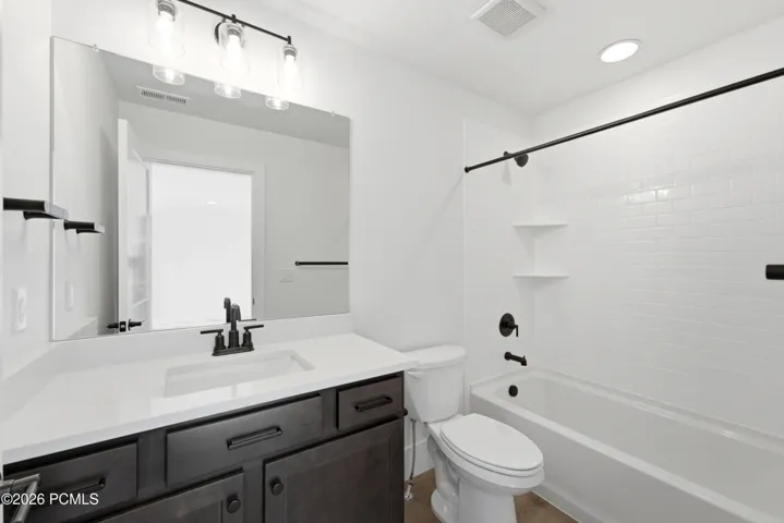 Upper level bathroom with bedroom 1