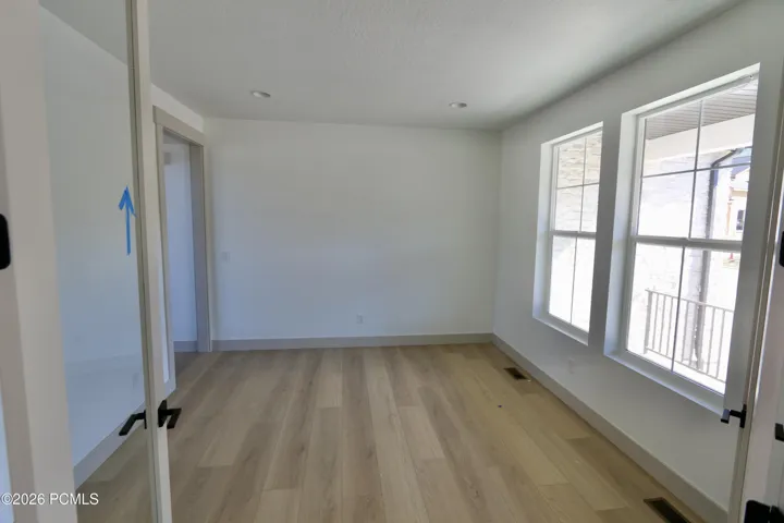 Living room or office with glass French doors and large windows