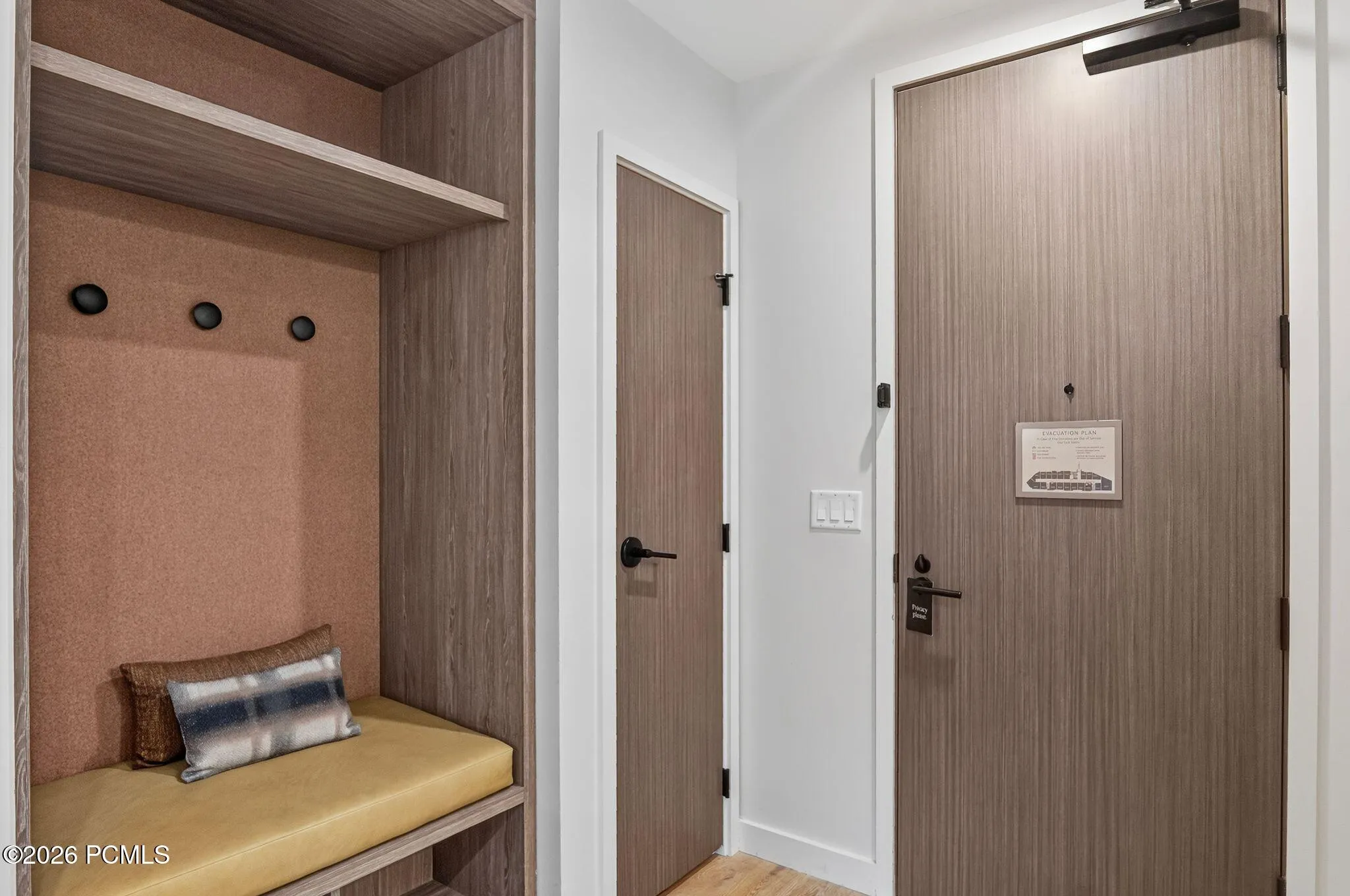 Entry hall with bench seating and closet storage for ski boots, skis and gear.