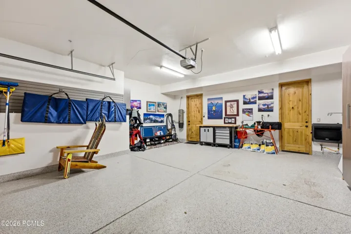 Garage with epoxy flooring, cabinets and heater