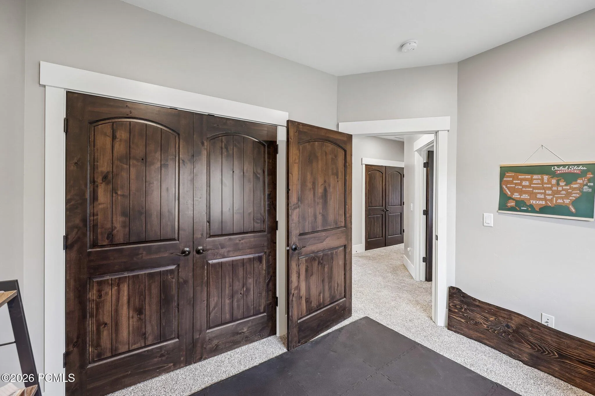 Upstairs hallway connecting two guest bedrooms, a full bath and the primary suite on a single bedroom level.