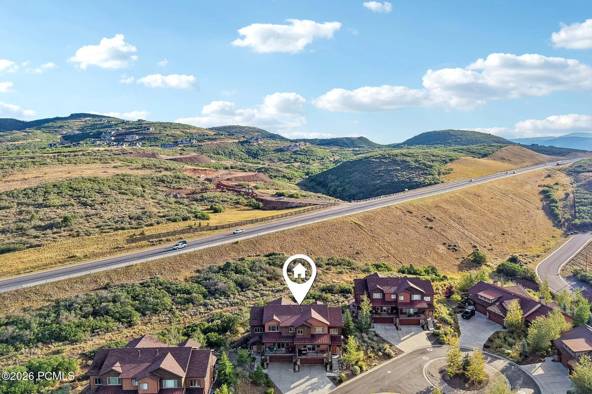 Aerial map view with a location pin marking the home's site on the edge of Rustler at Hideout, above Jordanelle Reservoir.