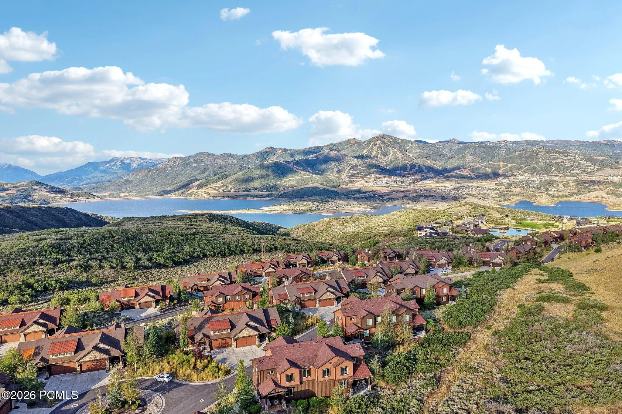 Aerial view of Jordanelle Reservoir above the rooftops of the Rustler at Hideout community in Hideout, Utah.