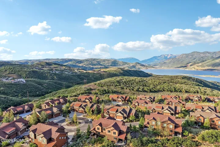 Wide aerial of the Hideout, Utah community with Jordanelle Reservoir beyond, showing open space and quick Highway 40 access to Park City.