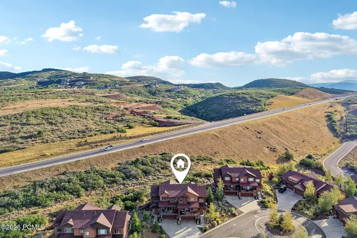 Aerial map view with a location pin marking the home's site on the edge of Rustler at Hideout, above Jordanelle Reservoir.
