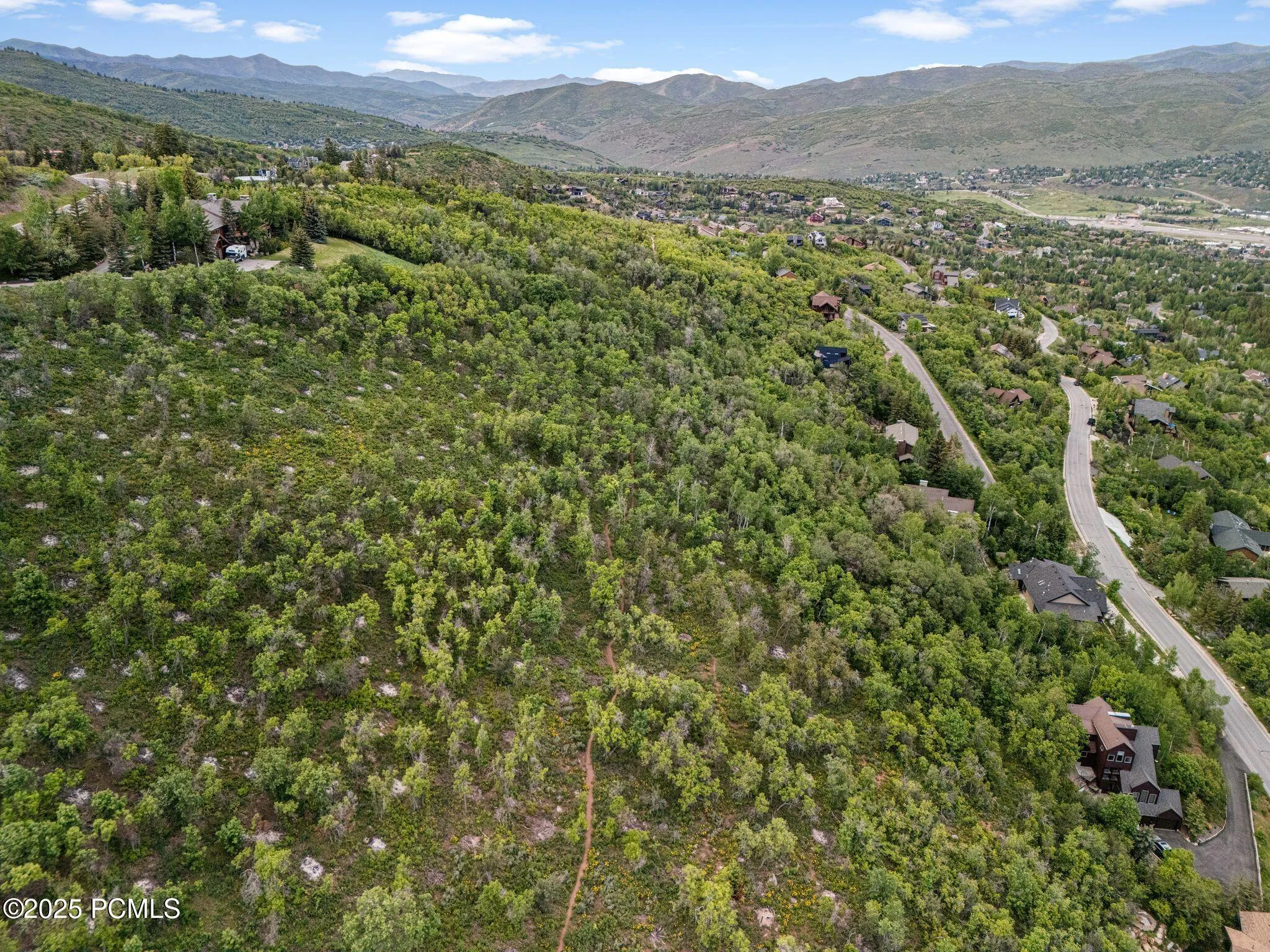 Elevated perspective looking out over the Snyderville Basin and I-80 corridor - minutes to Kimball Junction, Quarry Village, and Park City Mountain.