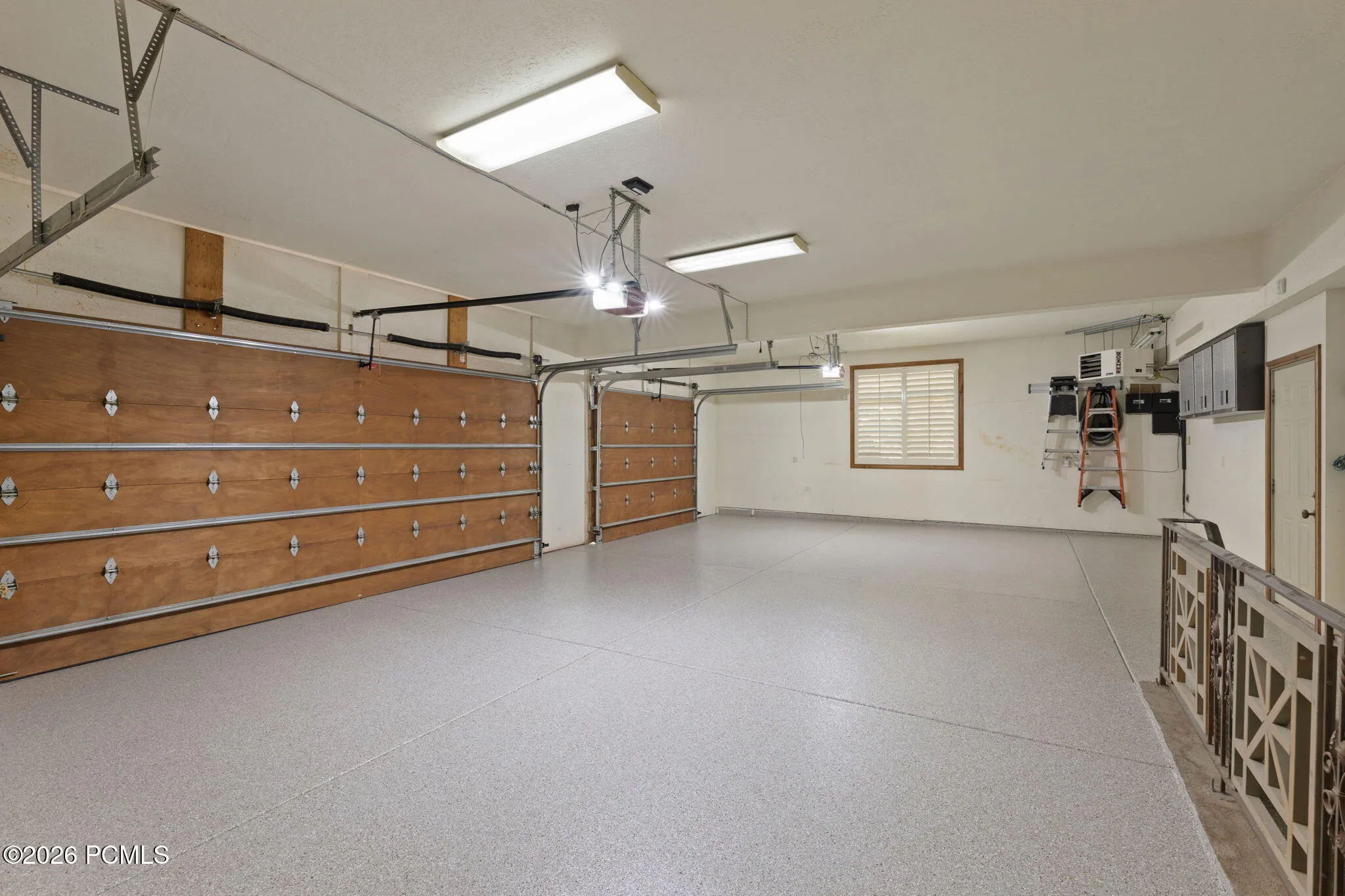 Three car garage w/epoxy flooring