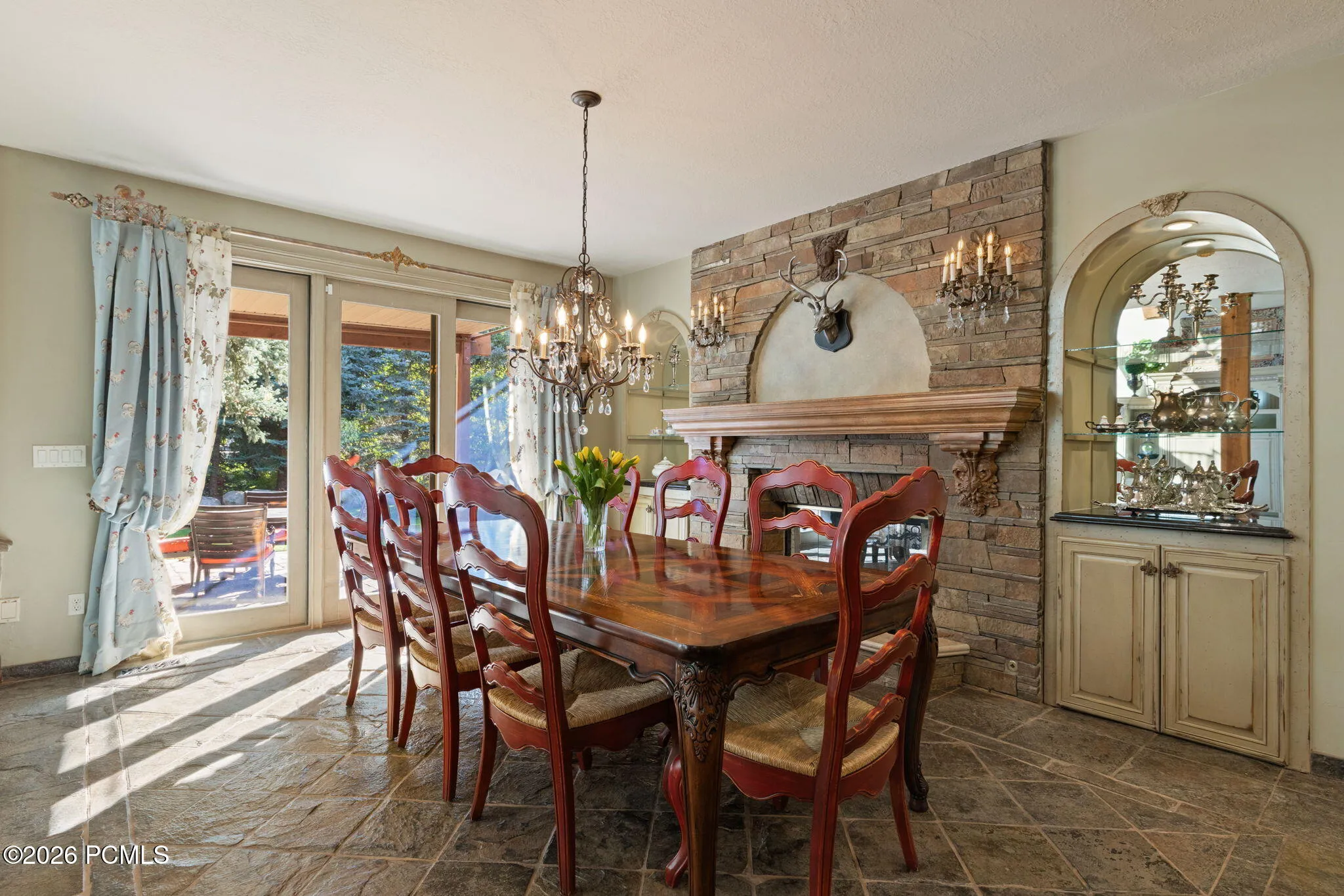 Dining area next to kitchen w/ fireplace