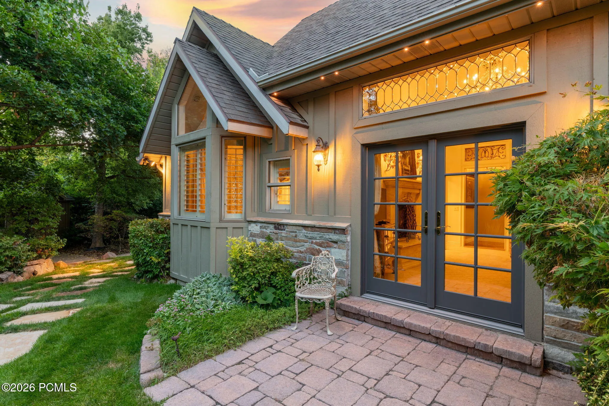 Primary suite doors to patio and yard
