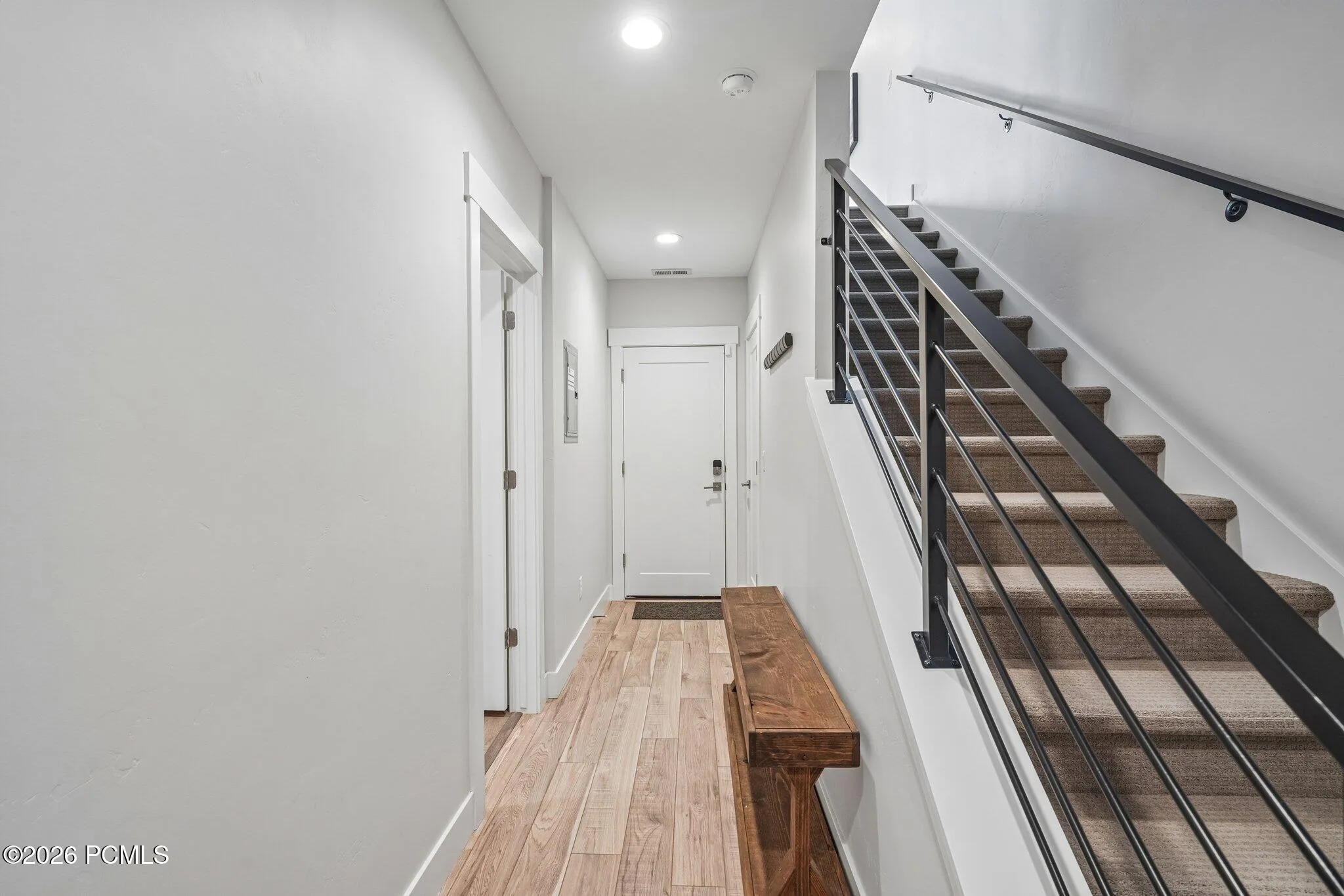 Entry hall and staircase connecting all three levels.