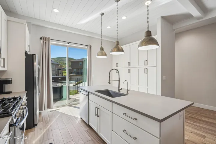 Kitchen island and counter seating with direct access to the patio slider.
