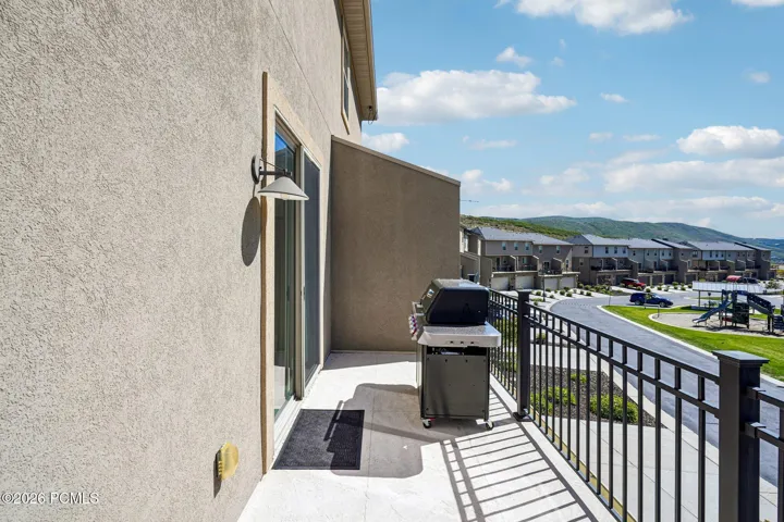 Private deck with mountain views and space for a grill.