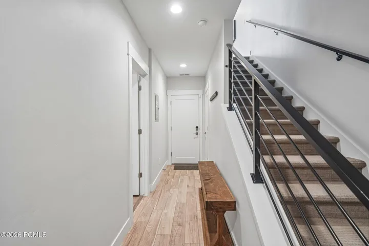 Entry hall and staircase connecting all three levels.