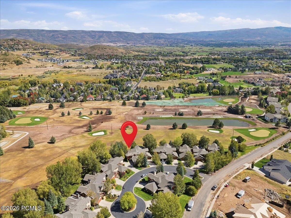 Aerial perspective showcasing the golf course community, and the surrounding valley