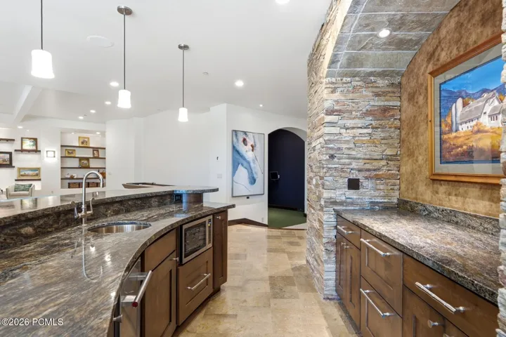 Entertain up and down with this fantastic wet bar, refrigeration, ice maker, and dish washer.