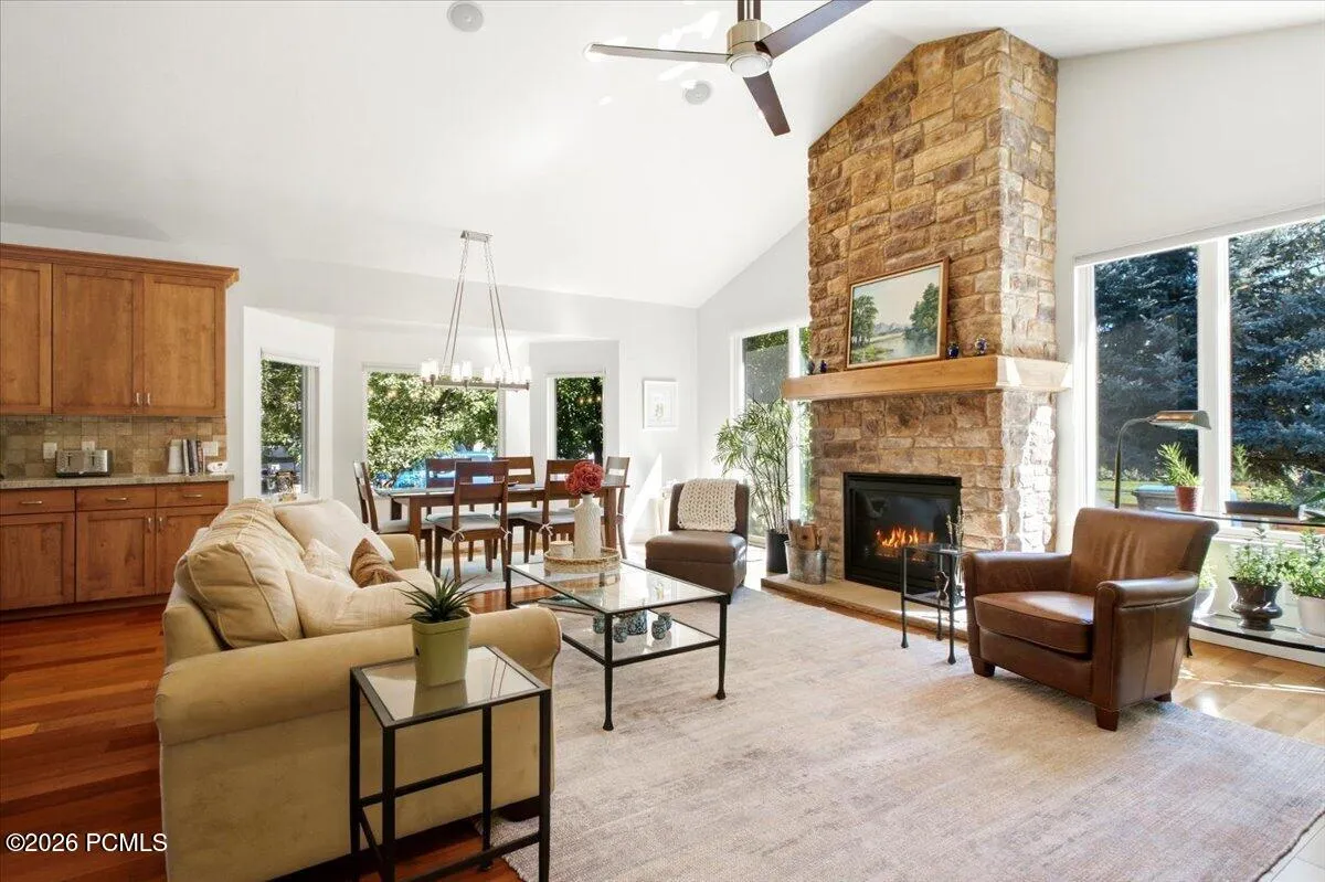 Open-concept living space featuring abundant natural light from expansive multi-pane windows
