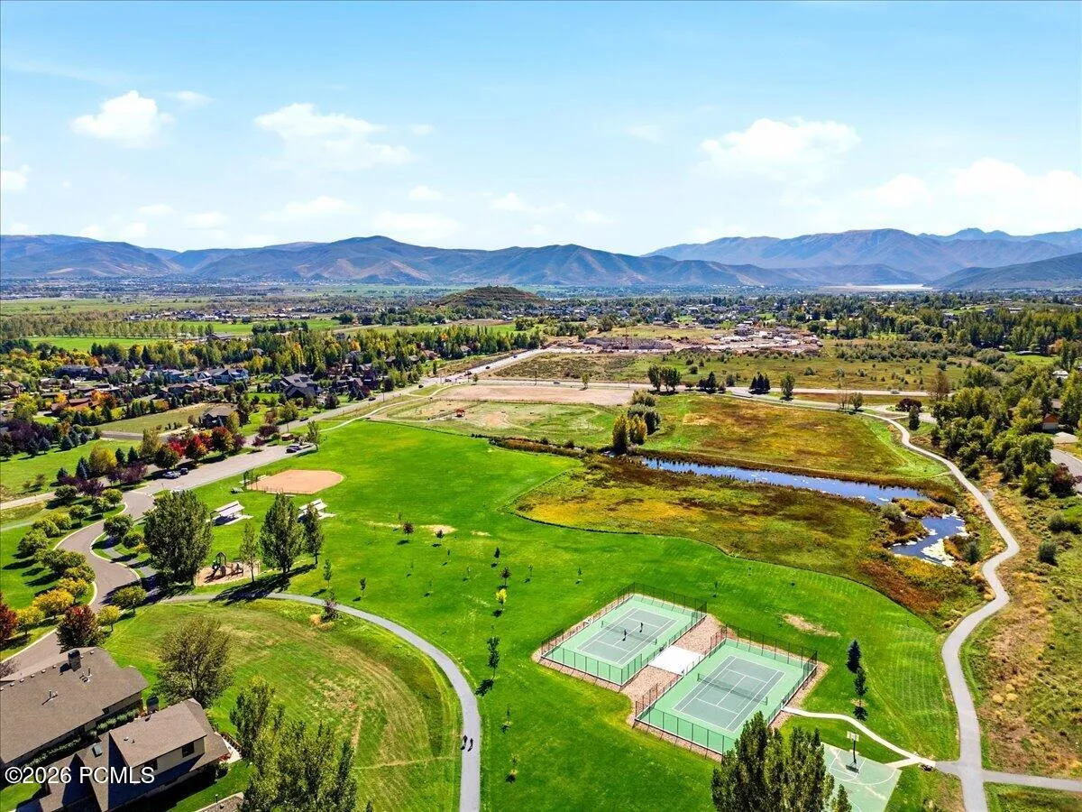 Expansive community green space with paved walking paths