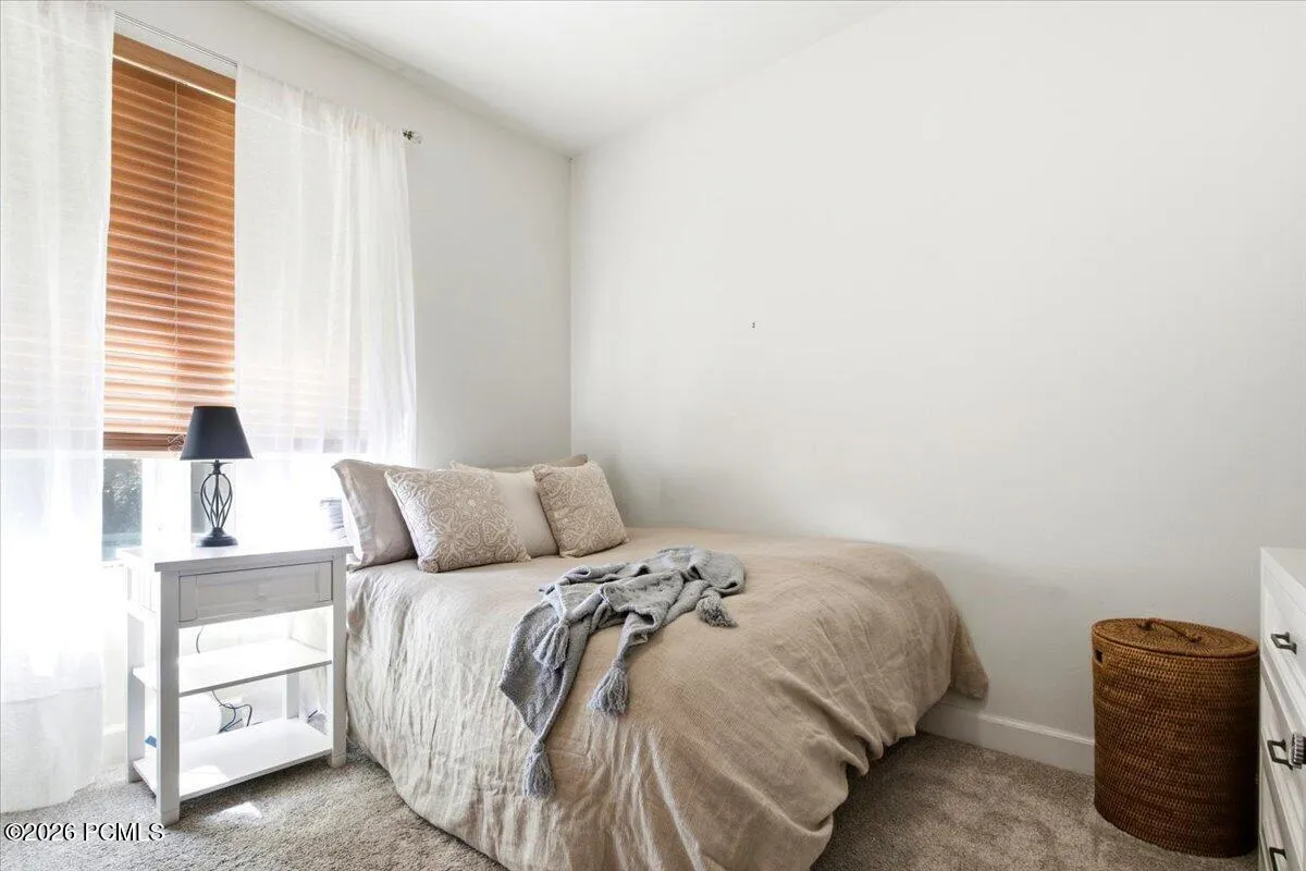Bedroom featuring tall ceilings