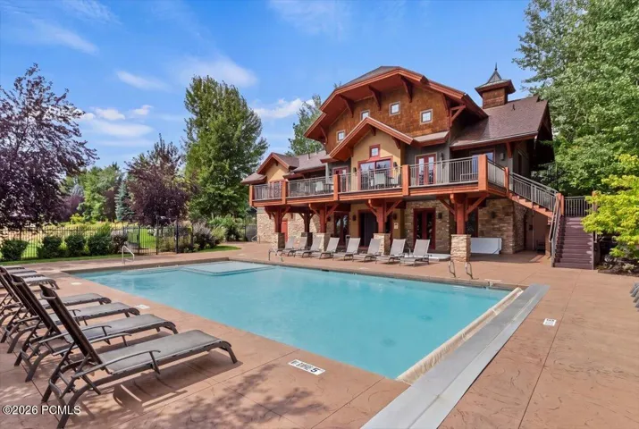 Community clubhouse featuring a pool