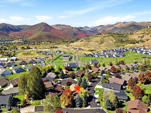 Aerial view of home surrounded by beautiful mountains