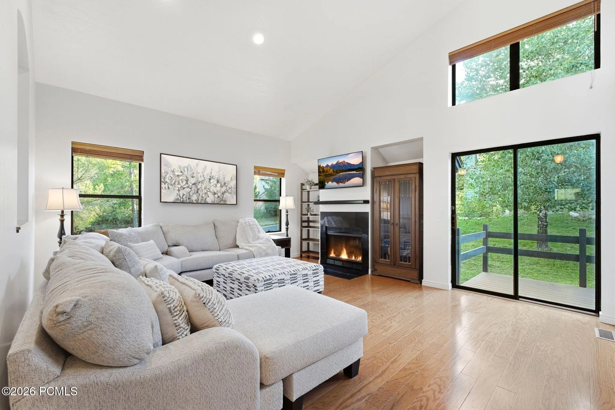 Great room with a wall of glass to the deck and backyard.