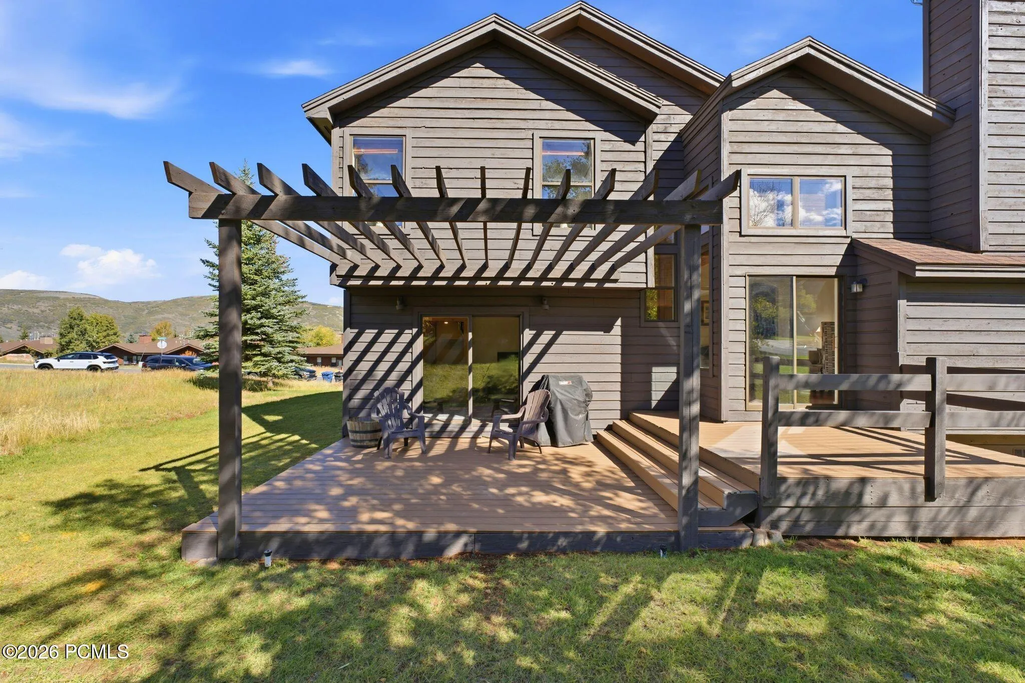 Deck off the main level overlooking the yard.