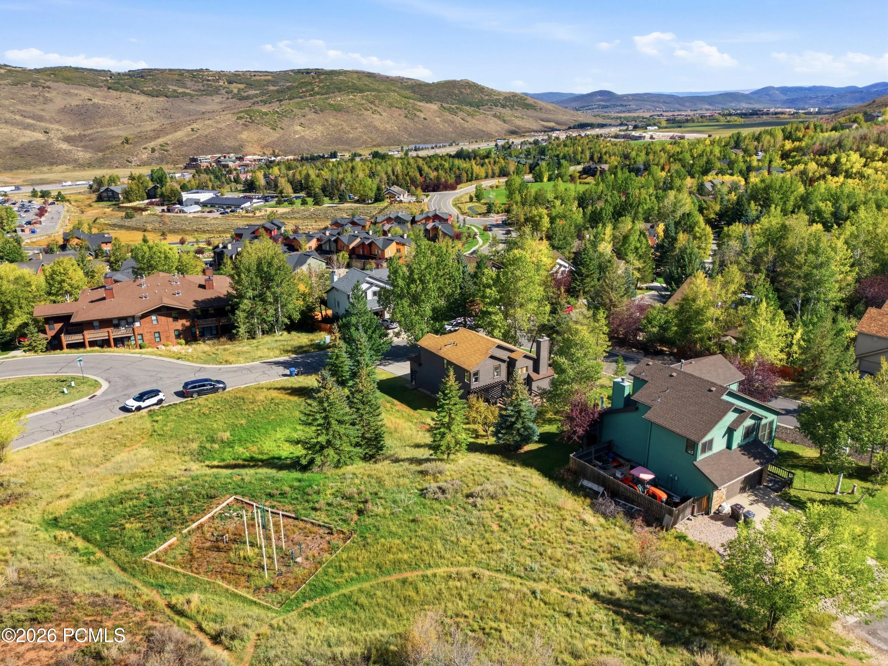 Aerial view showing the park and trail access next to the property.