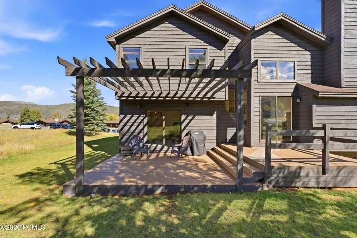 Deck off the main level overlooking the yard.
