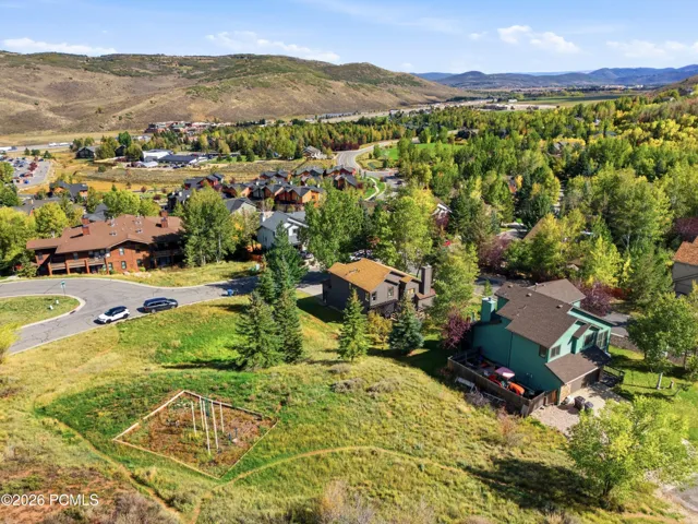 Aerial view showing the park and trail access next to the property.