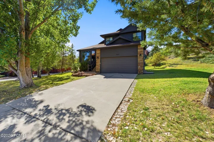 Welcoming front entry with a wood door and leaded-glass window.