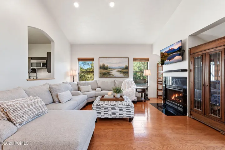 Open sightlines from the front entry through the great room to the kitchen. Virtually staged.