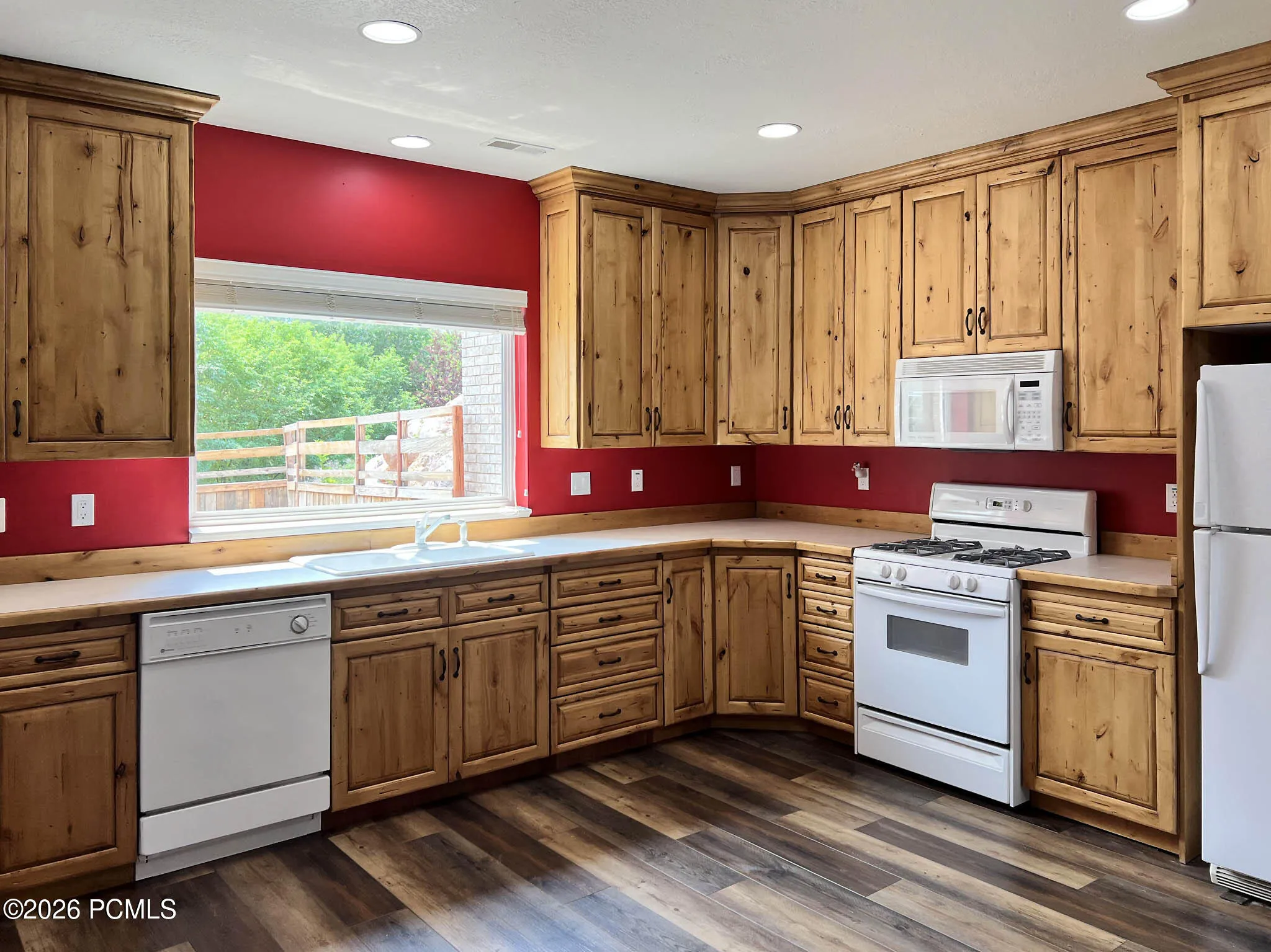 Lower-level kitchen w/ knotty alder cabinets