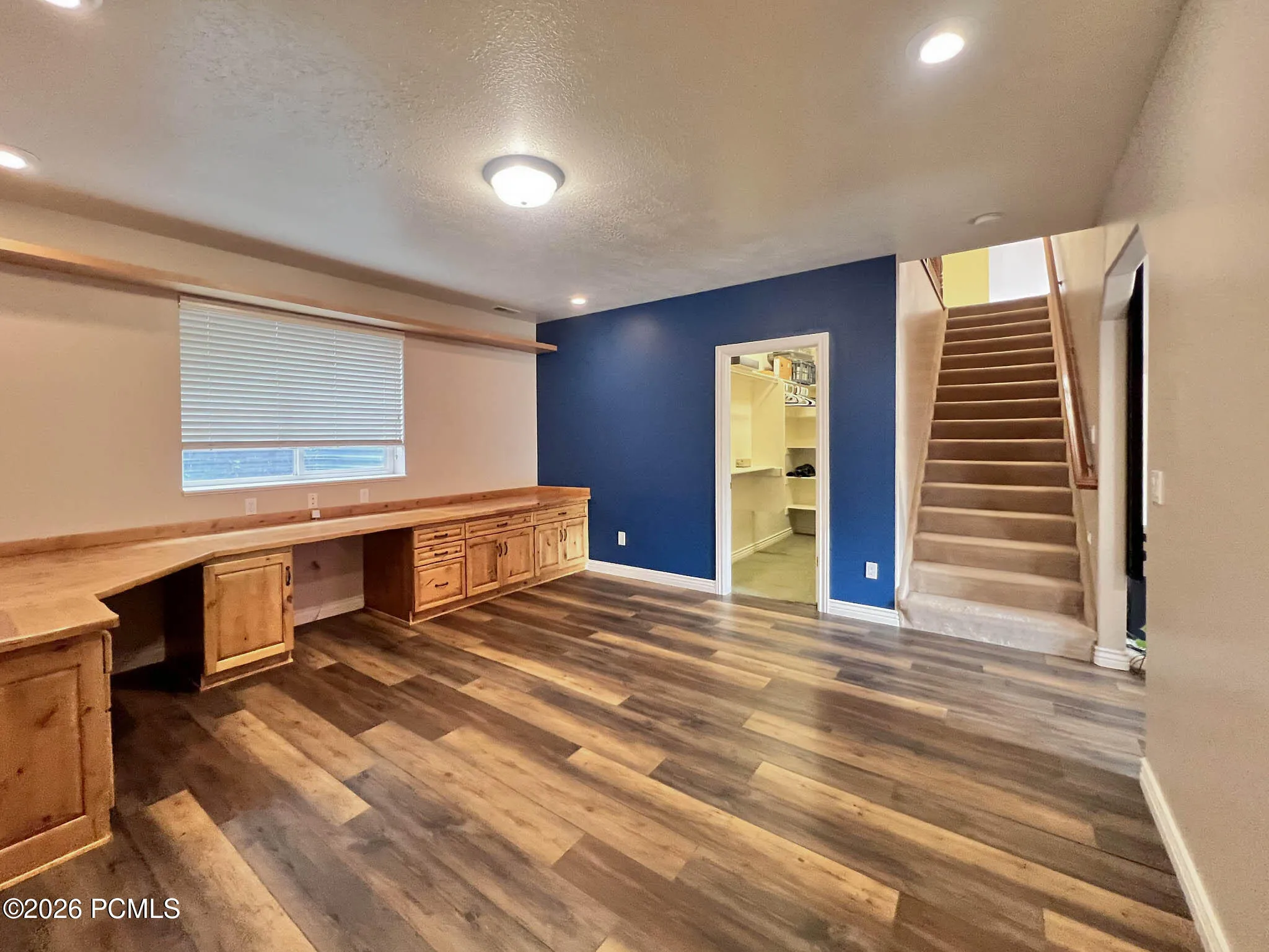 Lower-level den/office w/ knotty alder built-in desks and cabinetry