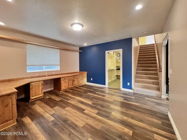 Lower-level den/office w/ knotty alder built-in desks and cabinetry