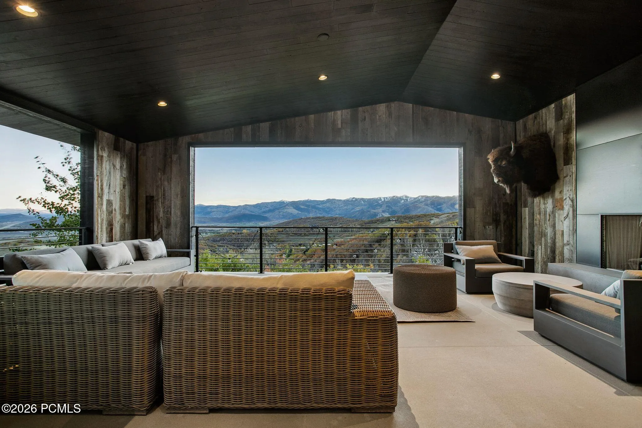 Indoor/outdoor office or bedroom with attached bathroom, floor to ceiling sliding glass doors and views of Park City & Deer Valley