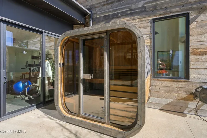 Brand new standalone outdoor sauna featuring a cedar interior is just steps from the gym and the primary suite.